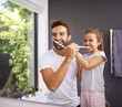 © peopleimages.com - Home, brushing teeth and father with girl, cleaning mouth and morning routine with hygiene. Family, dad and daughter with fresh breath, grooming or oral care with dental wellness, healthy or bathroom