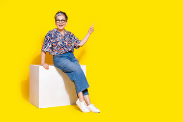 Sticker - Full body photo of attractive retired sit cube point empty space dressed stylish colorful clothes isolated on yellow color background