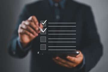 Poster - Checklist concept. Person use smartphone to checking mark on checkboxes for business performance monitoring and evaluation.