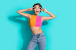 © deagreez - Photo of flirty excited woman wear pink orange top showing two v-signs looking empty space isolated teal color background