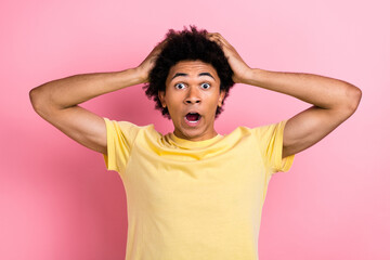 Poster - Photo of pretty impressed guy dressed yellow t-shirt open mouth arms head big eyes isolated pink color background