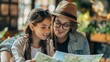 © Galib - Young woman and her daughter are looking at a map together. They are smiling and seem to be enjoying their time together.