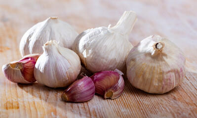 Wall Mural - Image of fresh garlic on wooden background, nobody