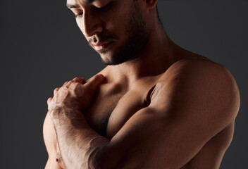 Poster - Fitness, shoulder or man in studio with thinking, close up or muscles on black background. Active person, bodybuilder or topless for workout with flex, athlete and healthy body or pride with progress