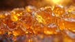 © Old Man Stocker - Golden Cannabis Concentrate Crystals. Close-up of golden cannabis concentrate crystals, showcasing the purity and quality of cannabis extracts.