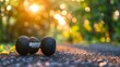 © mongkonchai - Close-up of metal dumbbell with a textured grip on a simple background, fitness and strength training concept, banner backdrop.
