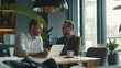 © Kafka - Professional Dialogue Between Two Men in Stylish Office Setting