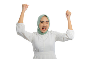 Wall Mural - Excited young Asian woman in green hijab and white blouse gesturing yes with raised hand, celebrating victory, success isolated on white background