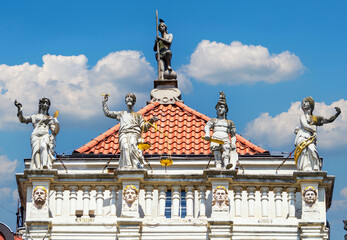 Wall Mural - Beautiful ancient house in Gdansk. Medieval statues of antique gods on the roof