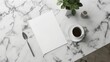 © Flowaiart - Marble desk setup with blank paper, coffee cup, spoon, greenery, and ink bottle for stylish and productive workspace inspiration.