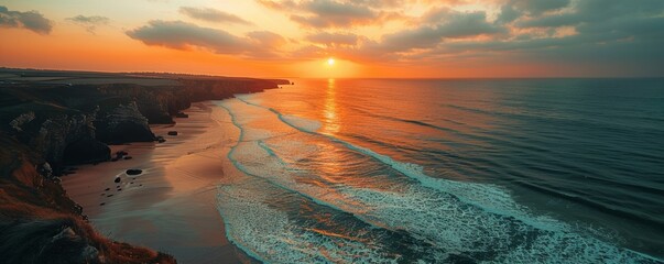 Wall Mural - Aerial view of clifftop, Bedruthan steps during sunset, Cornwall, United Kingdom.