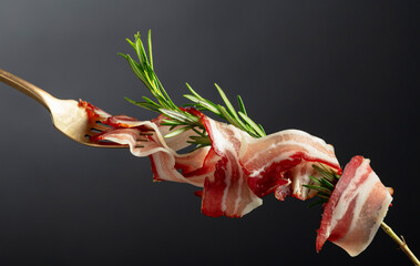 Wall Mural - Dry-cured pork belly bacon with rosemary.