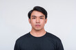 © Mdv Edwards - Handsome asian man in a black shirt isolated on white background