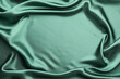© New Africa - Crumpled green silk fabric as background, top view