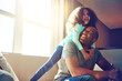 © peopleimages.com - Happy, dad and girl with hug on sofa in living room for support, love and gratitude on fathers day. Playful, black family and man with little kid at home for bonding, weekend and care in childhood