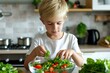 © anatolir - Focused child is engaged in making a healthy salad at home, highlighting healthy eating habits