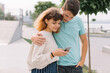 © anatoliycherkas - Two teenager, boy and girl in the park and using smartphone.