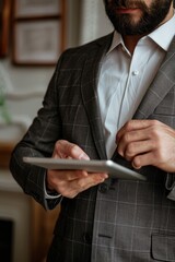 Poster - A person holding a tablet computer in his hand