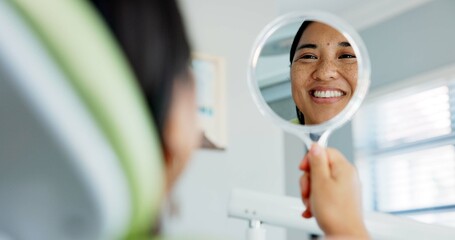 Poster - Dental, smile and happy woman with mirror check at a dentist for teeth whitening results. Mouth, oral care and Asian female client with tooth, cleaning or routine checkup in Tokyo with satisfaction