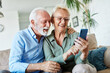 © Lumos sp - woman man senior retirement couple mobile phone phone home communication elderly adult happy smiling old mobile family husband mature wife