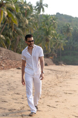 Wall Mural - man at the beach in white clothes