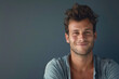 © MagnusCort - A close up portrait of a young man with a subtle smile