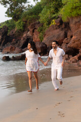 Wall Mural - family/couple walking on the beach