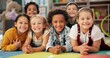 © N Lawrenson/peopleimages.com - Kindergarten, kids and face with smile on floor for education, knowledge and learning at academy. Students, friends and happy with diversity in school for child development, scholarship and bonding