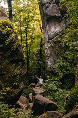 Sticker - couple tourists hiking at canyon in the forest