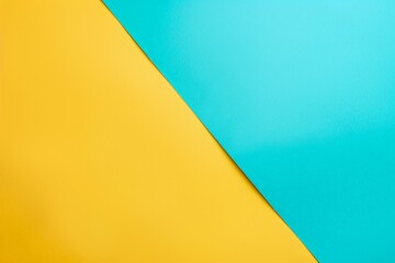 Poster - Trendy abstract background with yellow and blue paper in a diagonal line, perfect for business cards or presentations. Geometric shapes and vibrant colors add a modern touch