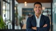 © Evon J - Portrait of smiling man in a business suit in an office environment. Professional headshot for corporate