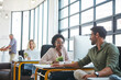 © peopleimages.com - Creative agency, business people and talking in office for discussion, planning and question. Workspace, colleagues or coworkers as content writer, journalist or editor to brainstorm for teamwork