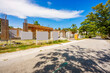 © Felix Mizioznikov - House construction with blank signs and fence. Industrial home development in Fort Lauderdale Florida