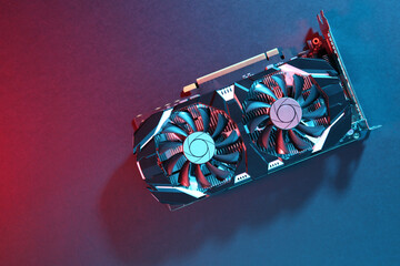 Poster - Computer graphics card on color background, top view. Space for text