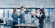 © SOMKID - Team working together in office, Excited Asian business team celebrating success in office, Business teamwork and marketing concept.