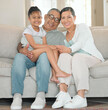 © peopleimages.com - Family, portrait and happy for love or relax in home living room with grandmother, grandpa and child. Grandparents, kid and smile as household for care, trust or bond together in house lounge on sofa