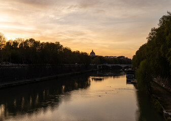 Wall Mural - Rome, Italy - April 11, 2024: Rome, Italy - April 11, 2024: Views of the Tiber River as it passes through the city of Rome, Italy