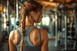 © gearstd - Woman in gym facing away with blurred face