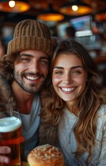 Wall Mural - Young couple taking a selfie, enjoying burgers and beer at a restaurant, capturing a fun moment together
