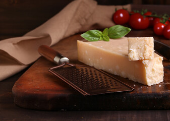 Poster - hard parmesan cheese on a wooden board