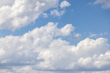 Wall Mural - Image of a partly cloudy sky with blue patches