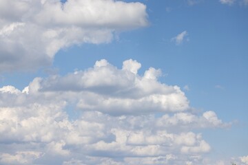 Wall Mural - Image of a partly cloudy sky with blue patches