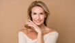 © Marko - beauty portrait of beautiful middle age woman on beige background