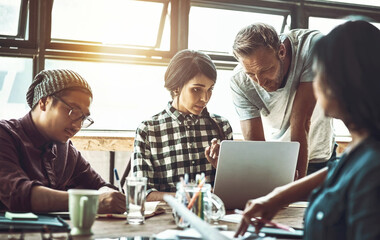 Poster - People, creative and laptop in office with manager or coach for work, career and company at table. Graphic design, agency and tech in workplace with review for market, brand and website aesthetic