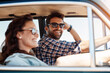 © NonVig/peopleimages.com - Couple, road trip and car for vacation and window, summer and adventure for explore together. Smile, sunglasses and love in countryside in transport, vehicle and sunshine for man and female people