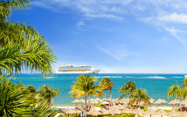 Wall Mural - View from tropical beach on cruise ship sailing from port 