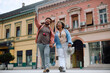 © Drazen - Happy tourist couple enjoying in sightseeing through city. Copy space.