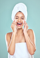 Poster - Smile, towel and woman for skincare or cleansing, cotton pads and pamper for blue background. Cosmetology, smile or hygiene routine for spot control, retinol or hyaluronic acid for female person