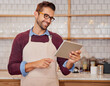 © Arnell Koegelenberg/peopleimages.com - Restaurant, waiter and man on tablet for online menu, checking stock and product inventory. Coffee shop, cafeteria and small business owner on digital tech for order service, research and website