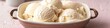 © Mehram - Elegant summer ice cream with white coconut scoops in a dish, ideal for copy space for text